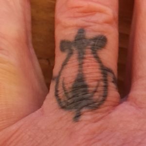 Bleeding-heart-wedding-ring-on-Michaels-hand